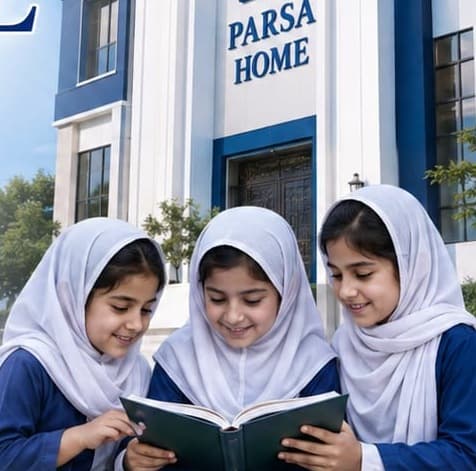 Parsa Home: three girls in school uniform reading a book together outside the home.